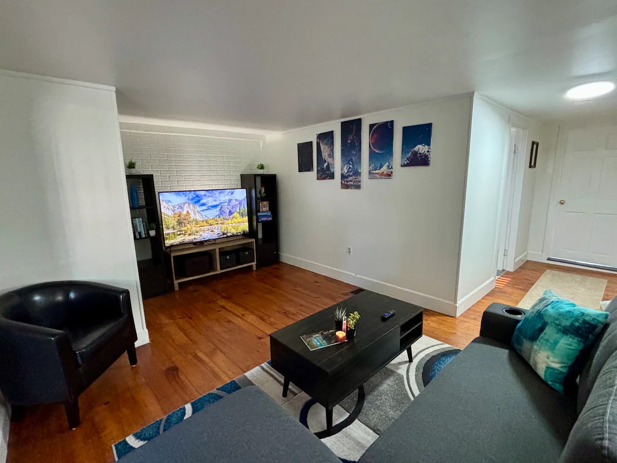 38 Fordway — living room with sectional and smart TV